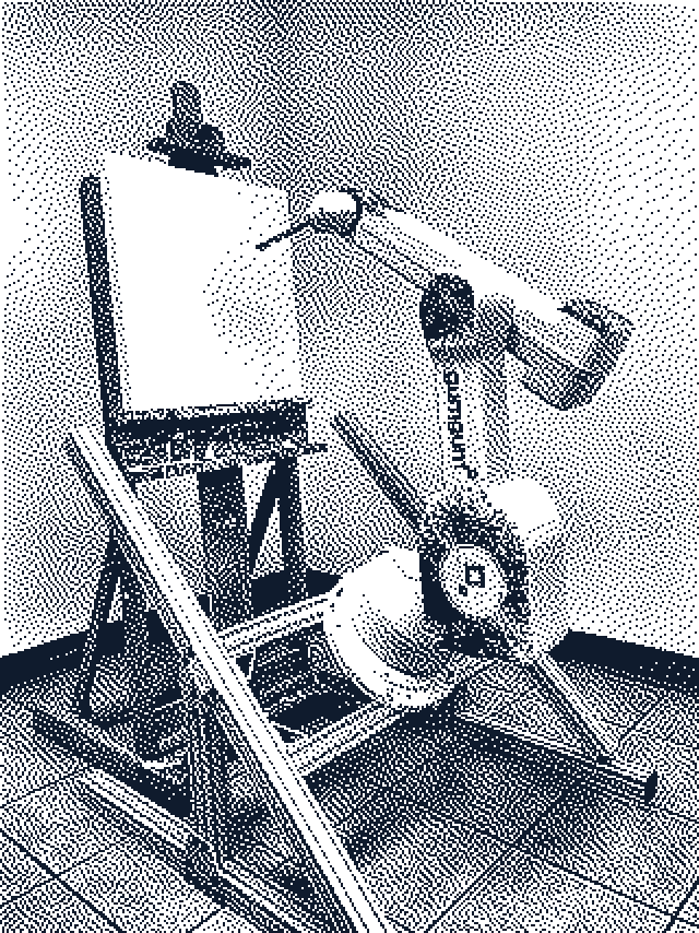 1-bit image: Art.ificial: the robot painter in its GumGum wrap, before the first stroke, 2018. Robot and code: Pindar Van Arman's CloudPainter.